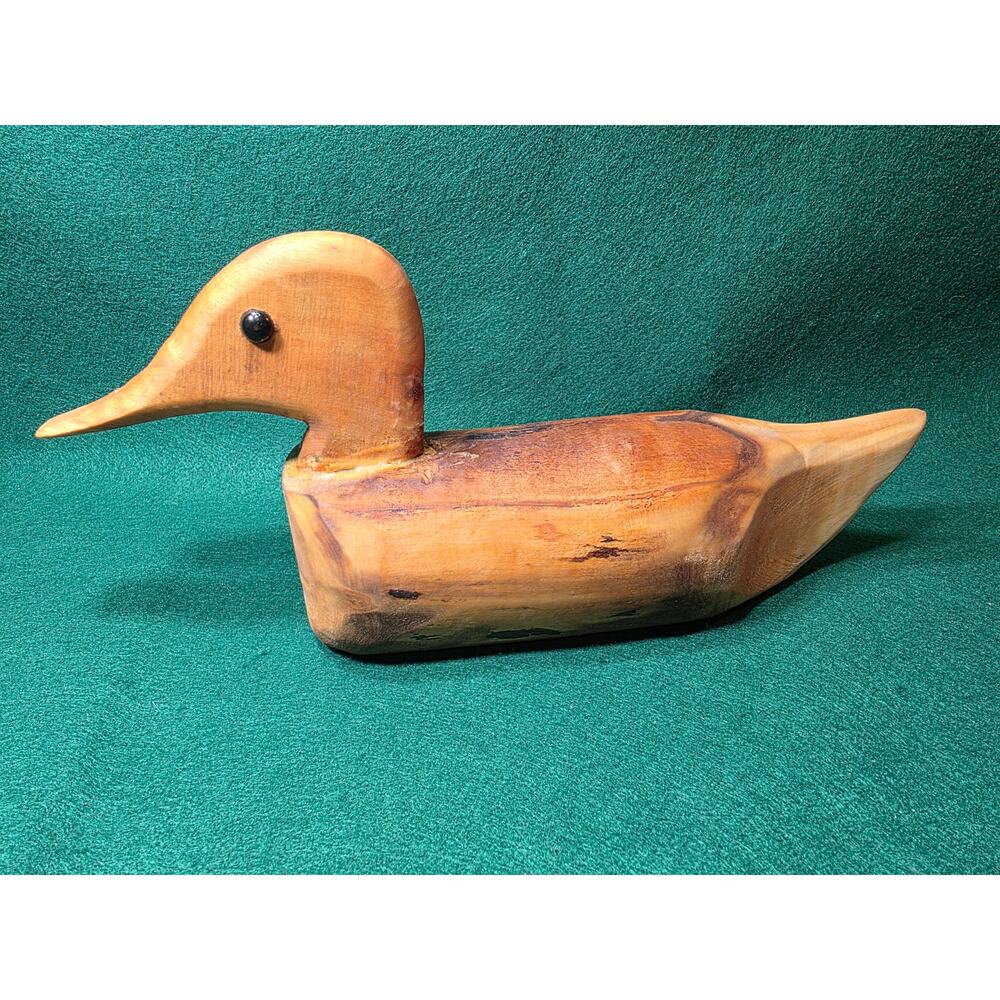 This carved wood duck is made from a driftwood log.